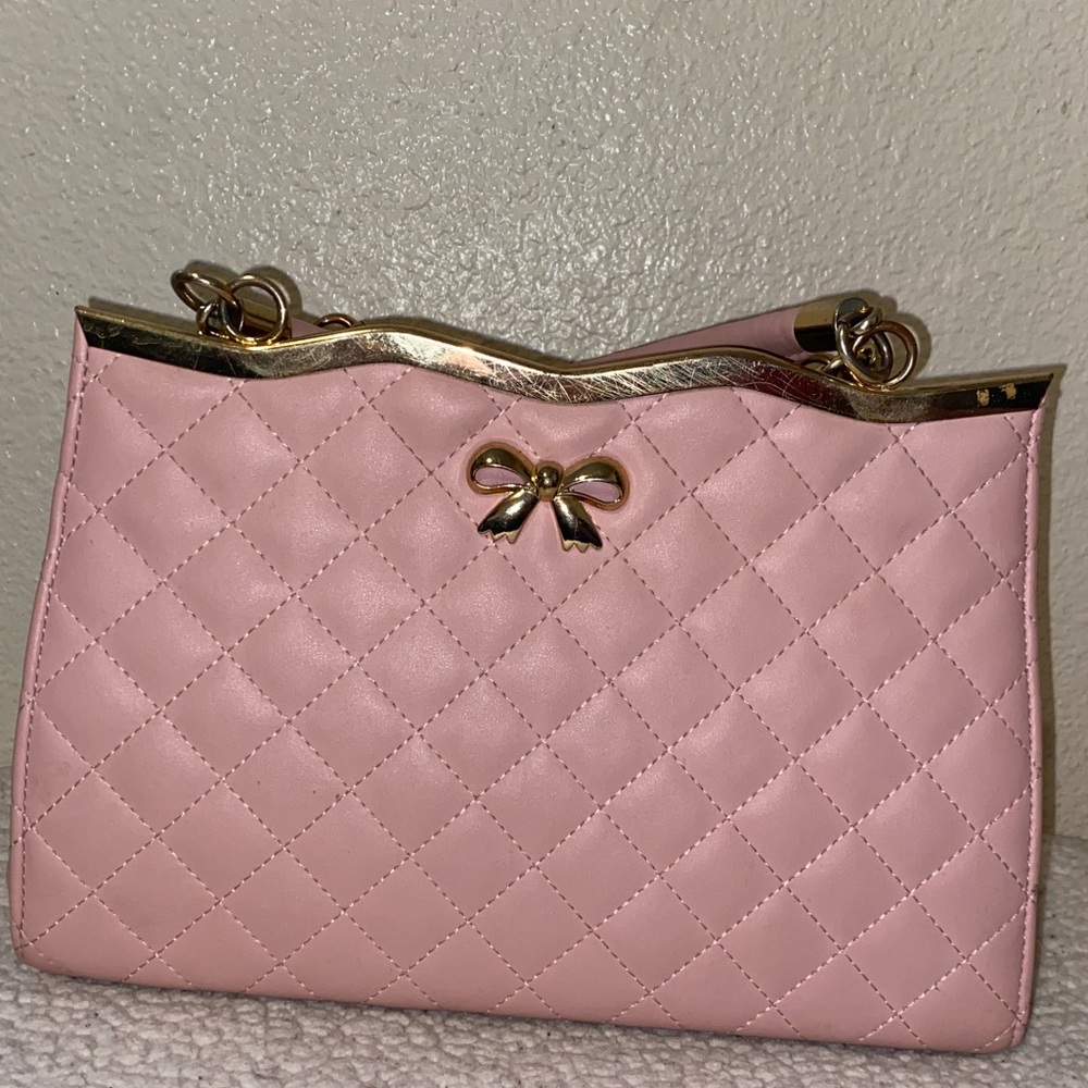 Super cute pink small handbag.